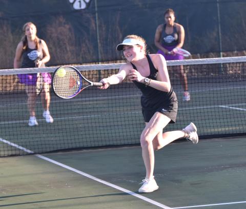 Senior Bonnie Greer Madden reaches for a volley Tuesday in action against Monroe Area in Carnesville. (Photo by Scoggins)