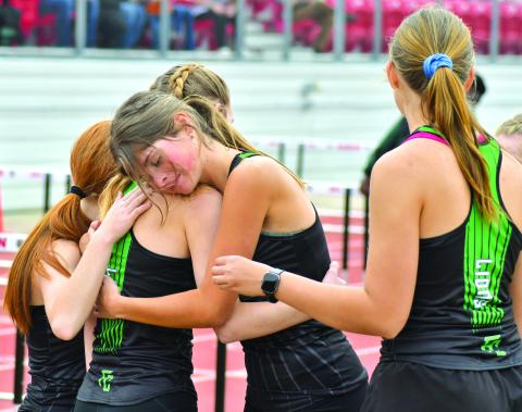 The Franklin County Lady Lions’ 4x800 relay team of Jocelyn Dean, Ella Hodges, Katie Mathis and Megan Hightower celebrate their first-place finish at the Bo James Invitational Saturday in Rabun County. (Photos courtesy of The Clayton Tribune)