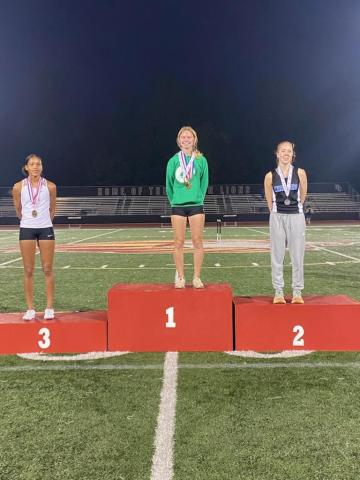 Freshman Megan Hightower (center) won the Region 8AAA championship in the 3,200 meters and will lead 18 other Franklin County athletes to the state sectional meet Saturday in Atlanta.