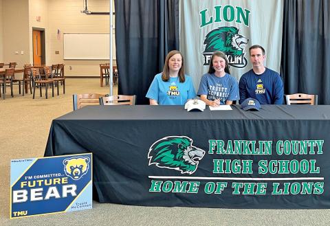 Ashtin Strickland (center), joined by her parents Ashley and Dustin, recently signed a golf scholarship with Truett-McConnell University.