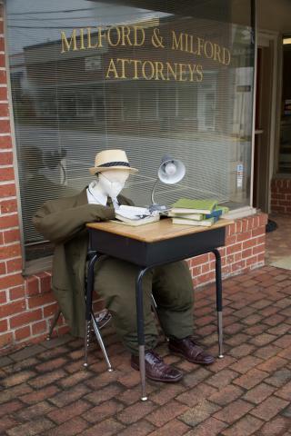 A new scarecrow partner at Milford & Milford Attorneys has set up a desk on the downtown Carnesville Square ahead of the city’s Festival and Fair this weekend. 