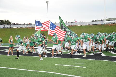 To commemorate Heroes Night, during which public servants and military members were recognized, the Franklin County Lions took the field carring American flags Friday at Jeff Davis Field at Ed Bryant Stadium.