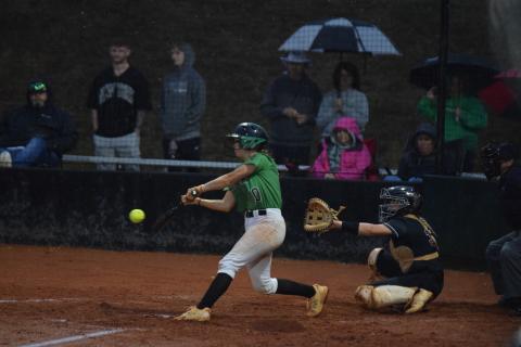 Keely Emmons gets a hit during a rainy Region 8AAA championship-deciding game last week against Hebron Christian Academy. (Photo by Scoggins)