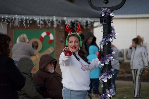 Ashley Rose Dodd of the City of Lavonia points the way to fun during the Winter Wonderland of Christmas event Tuesday. 