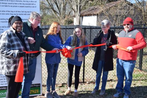 Cutting the ribbon Saturday on the new Paws & Play Dog Park are (from left) former Carnesville Council Member Patsy Watkins, former Mayor Harris Little, Kate Graham, Brooke Tate, Mayor Missy Holbrook and Council Member Wesley Dove.