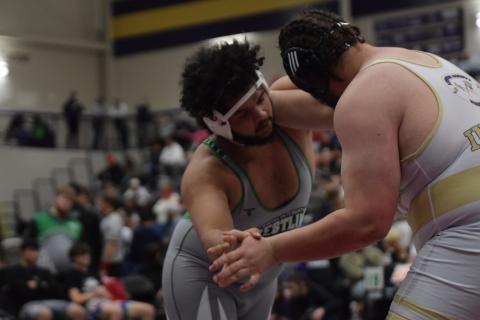 Lion Jacob Baker takes on a Lumpkin County wrestler in the state duals semifinals Saturday in Dahlonega.