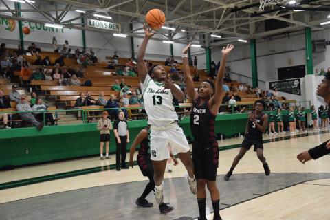 Jordan Ardister goes up for a shot against Hebron Christian Tuesday in the Lion’s Den. Ardister and the Lions will host Hart County in the regular-season finale Friday.