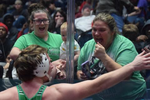 Moments after winning the state championship Saturday at the Macon Centerplex, Brady Simms celebrates with his sister Lacy Plontke (left) and baby Charlotte and his mother, Alicia Simms. (Photos by Scoggins)
