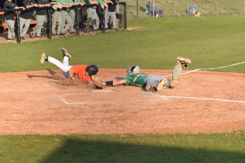 Lions catcher Will Dodd tags a Hart County runner out just before his hand reaches the plate in Region 8AAA action Thursday in Hartwell. Franklin swept a doubleheader with the Bulldogs to finish a sweep of the three-game series. (Photos by Scoggins)