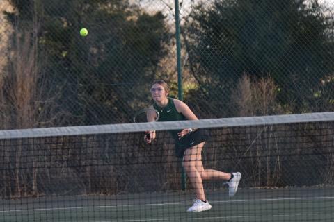 No. 1 singles player Olivia Phillips returns a ball in action Thursday against Stephens County.