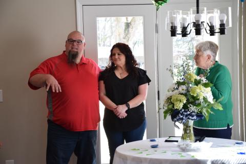 Pastor Nate Bunner (left) speaks before praying over the new home of Nikki Blakely (center) during a dedication ceremony Sunday. Blakely’s home was built by Franklin County Habitat for Humanity. It is Franklin Habitat’s ninth home, and Executive Director Mary Lou Jackson (right) said the ministry has room for two more homes on Rainbow Drive in Lavonia. (Photo by Scoggins)