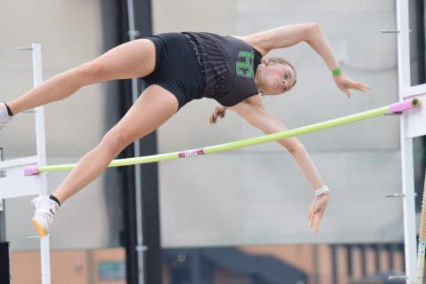 Macy Moore qualfied with a new school record in pole vault.