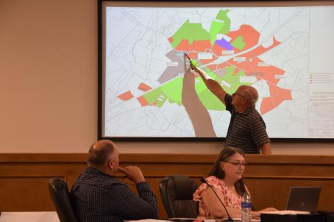 County Engineer John Phillips explains options for sewer service to property along I-85 at Exit 160 during Tuesday night’s meeting of the Franklin County Board of Commissioners. (Photo by Scoggins)