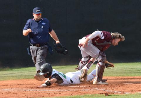 Senior Keilin Sanders slides safely between the legs of the Dawson County catcher to score in a second round state playoff series Monday in Carnesville. (Photos by Scoggins)