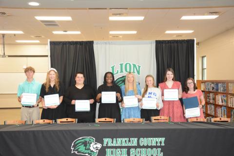Members of Georgia Future Educators signed certificates Tuesday indicating their intention to teach school in Georgia. Pictured during the signing ceremony in the Franklin County High School media center were (from left) Landon Floyd, Ryleigh Segars, Gwen Noel, Saniya Heard, Savanna Hart, Lealy Day, Helena Burton and Caitlin Buffington. (Photo by Eavenson)