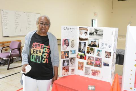 Janie Clark Richard (above) enjoyed the family history displays at Saturday’s Juneteenth celebration at the Spring Street Gym.