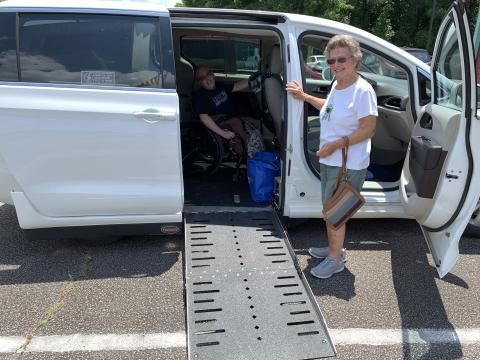 Wesley Bailey and his grandmother, Joyce Brooks, can get around much more easily now with the specially equipped van that his family recently purchased. (Photo by Eavenson)