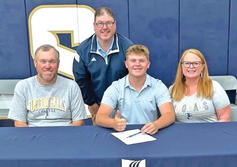 D.J. Seymour (seated center) signed a golf scholarship with Toccoa Falls College Thursday. He was joined by parents Todd and Patsy Voyles and Toccoa Falls Coach David Beddingfield.