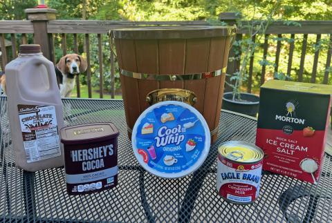 Sparky, the family’s Treeing Walker hound, spies the fixings for Tallulah chocolate on the NeSmiths’ backyard deck in Habersham County.  (Photo by Heather NeSmith)