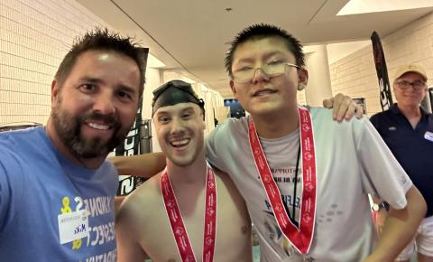 Carnesville Elementary School special education teacher Mike Schyck (left) takes a selfie with two swimmers at the Georgia Special Olympics held in May. Schyck volunteered at the event, held in Atlanta, and was assigned to the swimming competitions.