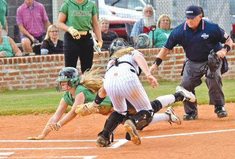 Senior Lenox Roberts (above) slides into home against Hart County last year.