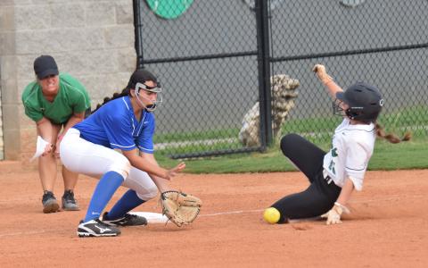 Hayden McGee slides into third base during Monday’s season-opening win over Oconee County at FCHS.