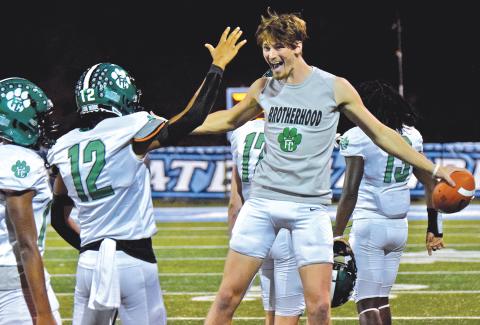 Blue Hart and teammate Jackson Burton (No. 12) celebrate Franklin County's 68-7 win over Johnson of Gainesville Friday. (Photo by Scoggins)
