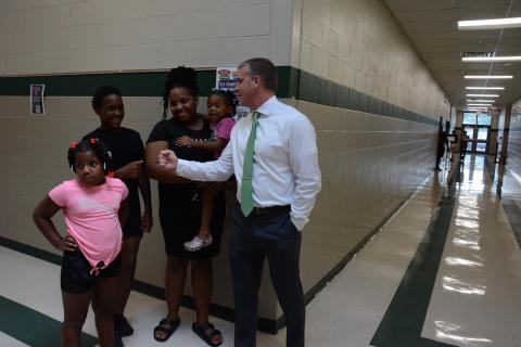 New Franklin County Middle School principal, Dr. David Cawthon, assists a family during the school’s open house on Tuesday. They are (from left) Paris Woulard, Xavier Ellis, Shamira Ellis and Zariah Woulard. (Photos by Eavenson)