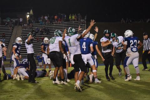 The Franklin County Lions celebrate quarterback Keyes Harbin’s (No. 33) touchdown with less than a minute to go that gave Franklin a 9-6 victory Friday over Banks County in Homer. (Photos by Scoggins)