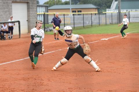 Catcher Keely Emmons prepares to make a throw to first after fielding a bunt against Prince Avenue Thursday in Carnesville. (Photo by Scoggins)
