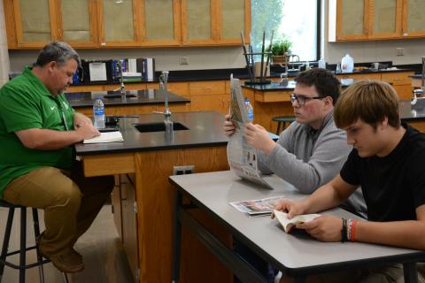 Franklin County High School Principal Matt Stowers (left) joins students in reading for 20 minutes a day, four days a week at FCHS. (Photo by Eavenson)