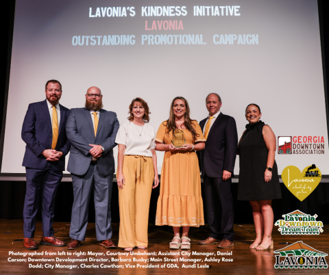 Accepting the Georgia Downtown Association’s 2024 Outstanding Promotional Campaign award from the City of Lavonia are (from left) Mayor Courtney Umbehant, Assistant City Manager Daniel Carson, Downtown Development Director Barbara Busby, Main Street Manager Ashley Rose Dodd and City Manager Charles Cawthon. Georgia Downtown Association Vice President Aundi Lesle (right) presented the award.