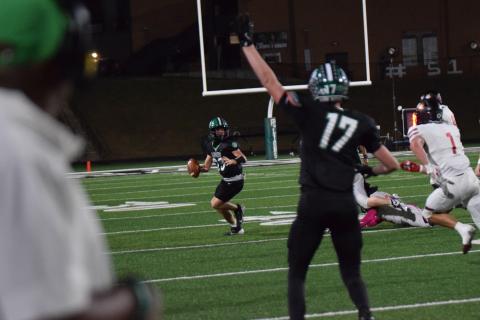 Keyes Harbin looks for a receiver as Everett Allegood signals he is open during Friday's game against Hebron Christian.
