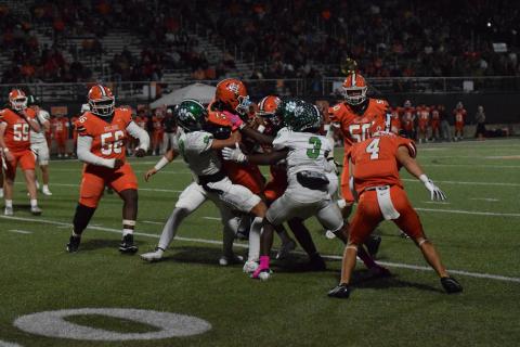 Franklin defenders Myles Kelley and Carmelo Hines brings down a Hart runner in action Friday in Hartwell. (Photo by Scoggins)
