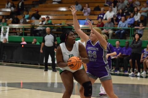 Ta’Kiyah Merriett looks for a shot in the season-opener Tuesday against Cherokee Bluff. (Photo by Scoggins)