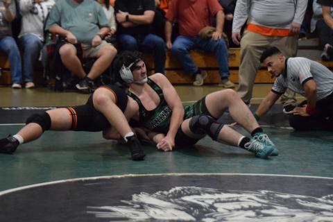 Lion Nate Stratton works to pin a Hart County opponent Tuesday in Carnesville. (Photo by Scoggins)