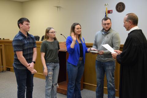 Probate Judge Ken Eavenson administered the oaths of office to newly-elected members of the Franklin County Board of Commissioners Monday. Taking the oath were incoming Commission Chairman Courtney Long (right photo), who was joined by husband Jeremy and children Nathan and Sidney; new District 2 Commissioner Cory Pulliam (below left photo), who was joined by wife Carrie; and new District 1 Commissioner Wanda Thompson (below right photo), who was joined by husband Stephen. The new commissioners will officia