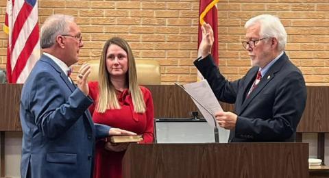 Incoming Northern Judicial Circuit Superior Court Judge Christopher NeSmith (left), with wife Melissa holding the Bible, is sworn in by Senior Judge John H. Bailey Friday at the Hart County Courthouse. (Photo courtesy of Patrick Fargason of The Hartwell Sun)