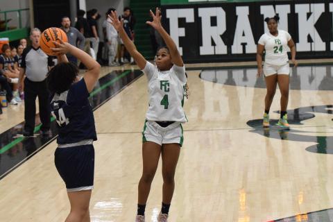Nykhia Johnson pressures a East Jackson ball handler during Friday’s win in the Lion’s Den. Johnson made eight three-pointers in the game and finished with 27 points.