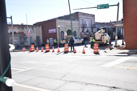 Highway 17 was blocked off for part of Monday at the intersection with U.S. Highway 29 after a tractor-trailer attempted to make a turn and damaged a building, traffic signal pole and fire hydrant. (Photo by Scoggins)