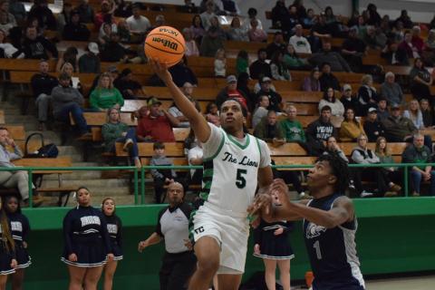 Frae’Quane Wilkins goes up for a layup during the Franklin County Lions’ victory Friday over East Jackson in the Lion’s Den. (Photo by Scoggins)