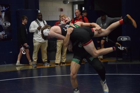 Franklin County Lion Josh Baughcum picks up an opponent for a takedown during action Saturday in the Inferno Invitational in Elberton. (Photo by Scoggins)