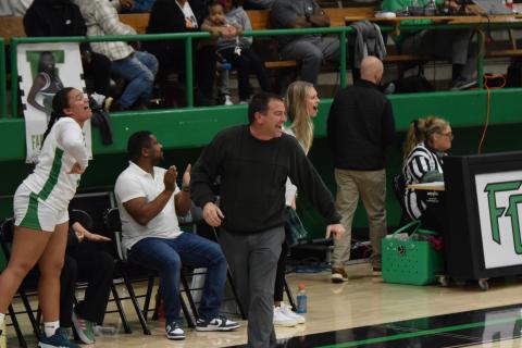 Franklin County Lady Lion Head Coach Chad Bridges (right photo, left) and Assistant Coach Bailee Breedlove react to a good play by the team in the game against Hart County. (Photo by Scoggins)
