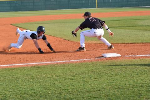 Keyes Harbin slides in safely to third in action against Hart County Friday at FCHS in Carnesville. The Lions swept the Bulldogs and have won six consecutive region contests. (Photo by Scoggins)