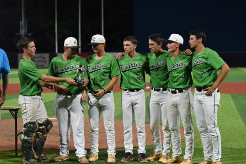 Franklin County Lion baseball seniors (from left) Colby Cape, Rowan Kennedy, Jackson Alexander, Parker Moorhead, Will Dodd, Cade Gibson and Ty Peeples accept the State Class AA Runner-up Trophy at AdventHealth Stadium in Rome May 21. (Photos by Scoggins)
