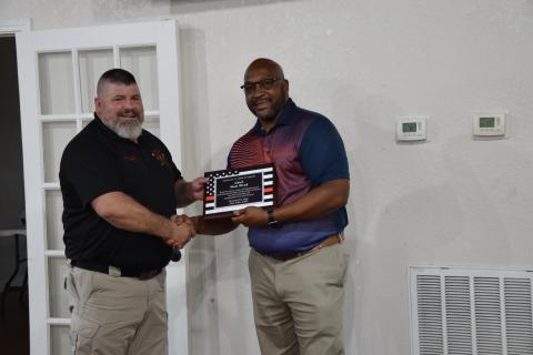 Retiring Royston Fire Chief Matt Elrod (left) was honored Tuesday with a reception at the Royston Depot. Mayor Keith Turman presented Elrod with a plaque commemorating his 33 years of service.