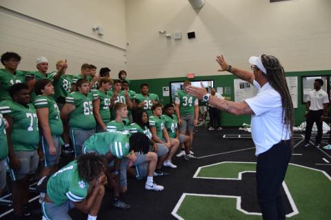 Coach Chuck Holland lines up his 2025 Franklin County Lion football team Tuesday during Picture Day at Franklin County High School.