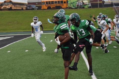 Gavin Wells celebrates with teammate Jeremiah Mayfield on his way to the end zone for a touchdown.