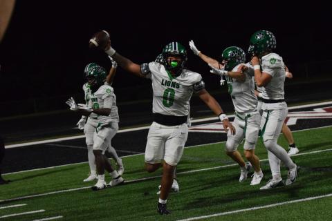 Senior D.J. Appleby comes up with a recovered fumble to end Friday night’s season opener in overtime, securing a 14-7 Franklin County Lion win over Chestatee. (Photos by Shane Scoggins)