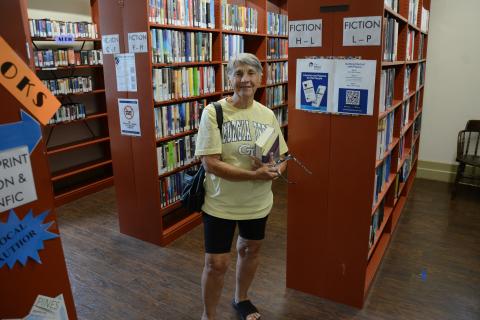 Barbara Meredith, who just recently moved to the area, was making her very first visit to the Lavonia-Carnegie Library when she overheard talk of reduced hours of operation beginning in September. (Photos by Charlie Eavenson)